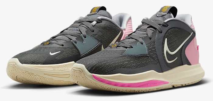 View of black and pink Nike shoes.